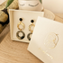 Packaging boucles d'oreilles Nāca fait main, pochette collection papier lokta noir et doré